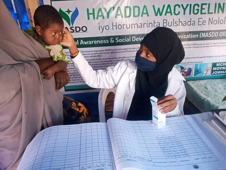 A NASDO nurse checking the blood level of a child under five