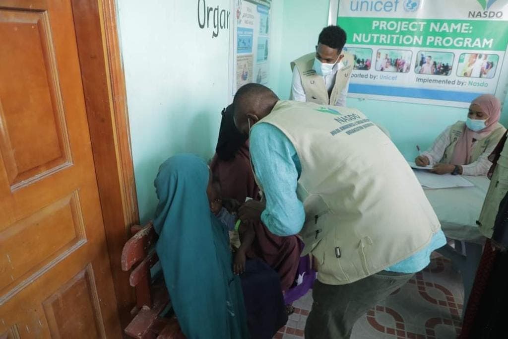NASDO clinicians delivering medicines during the rainy season in Moyko