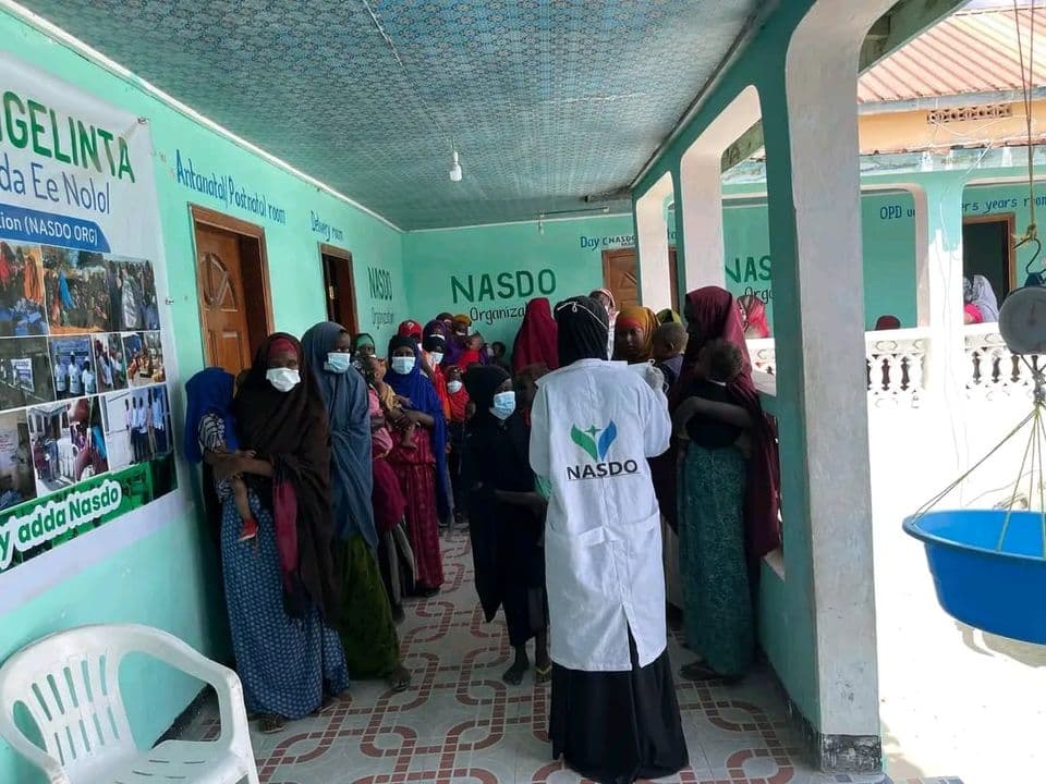 Health worker delivering education messages to mothers at Neero MCH